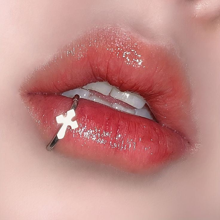 Cross lip ring